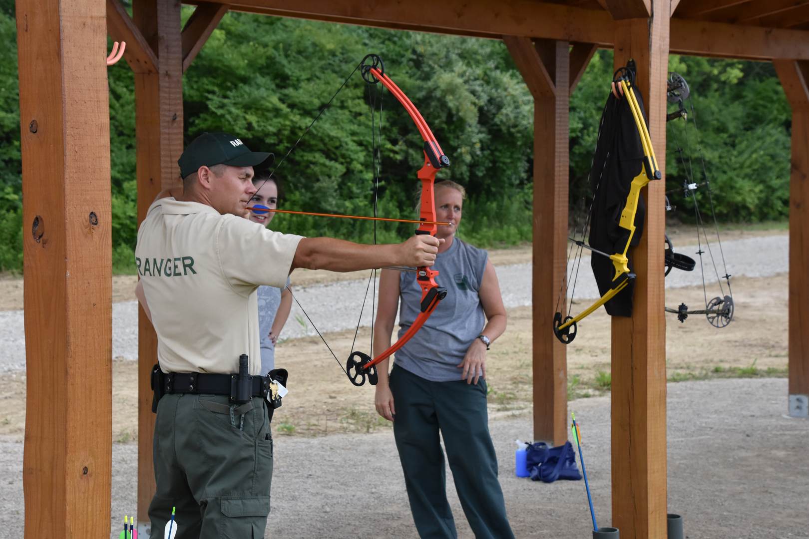 Scioto Grove Manager Geoff Hamilton shoots a compound bow at the static archery course.