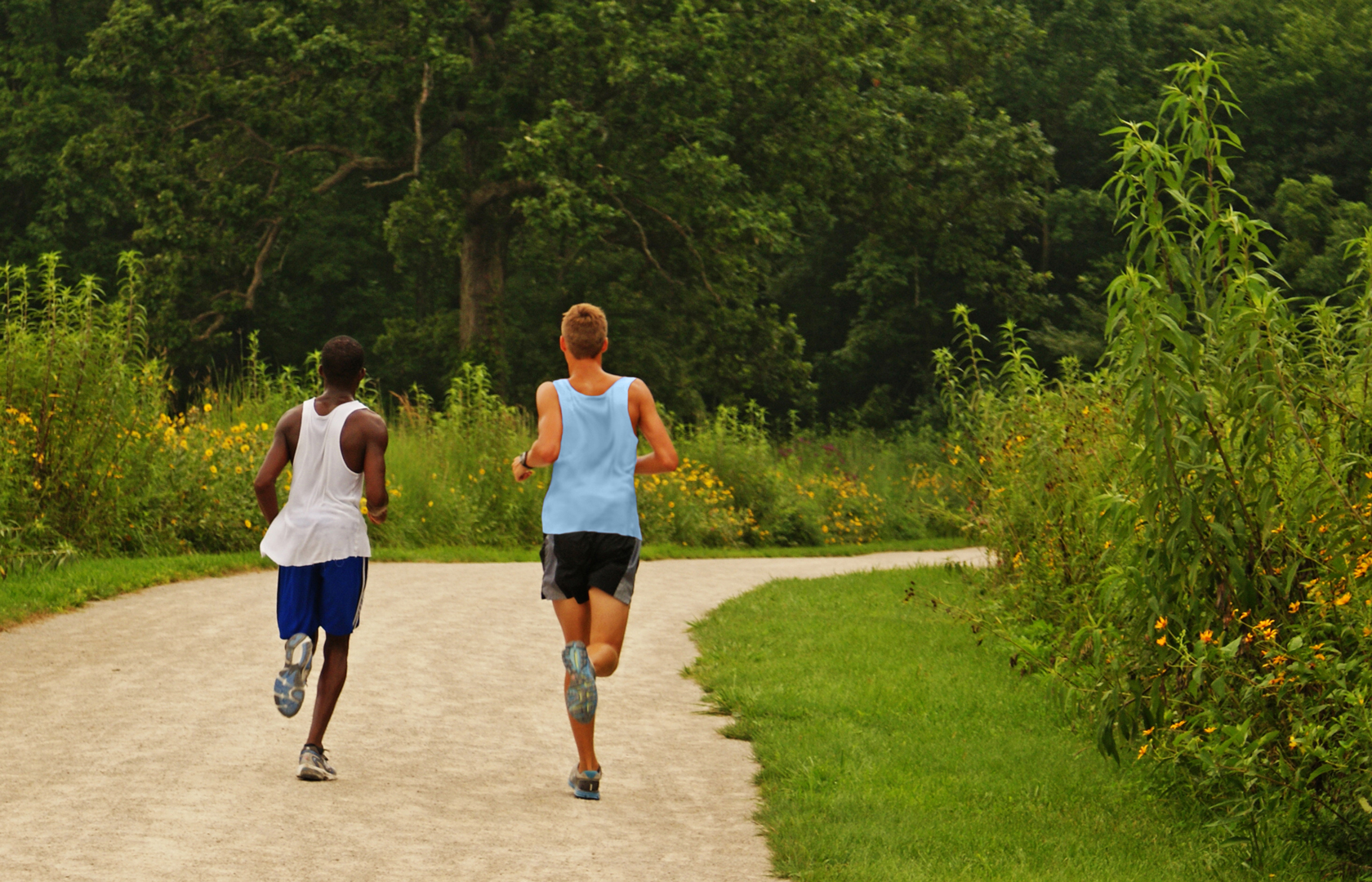 gallery-summer-BDC-joggers-on-Darby-Creek-Greenway-TinaCopeland Two boys jogging on Darby Creek Greenway Trail at Battelle Darby Creek Metro Park